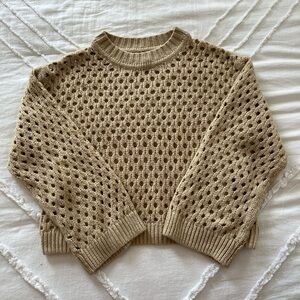 Tan and brown knit sweater with a relaxed fit